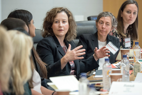 Photo of women sitting around a table