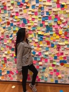 Joanna LaTorre in front of a post it wall