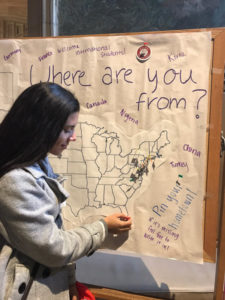 Joanna LaTorre in front of a Where are you from map