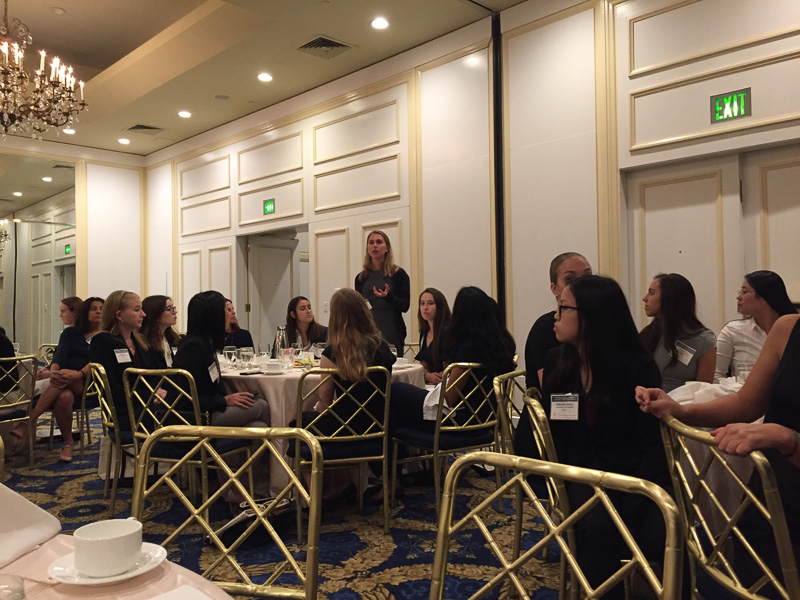 Students sitting around dinner tables