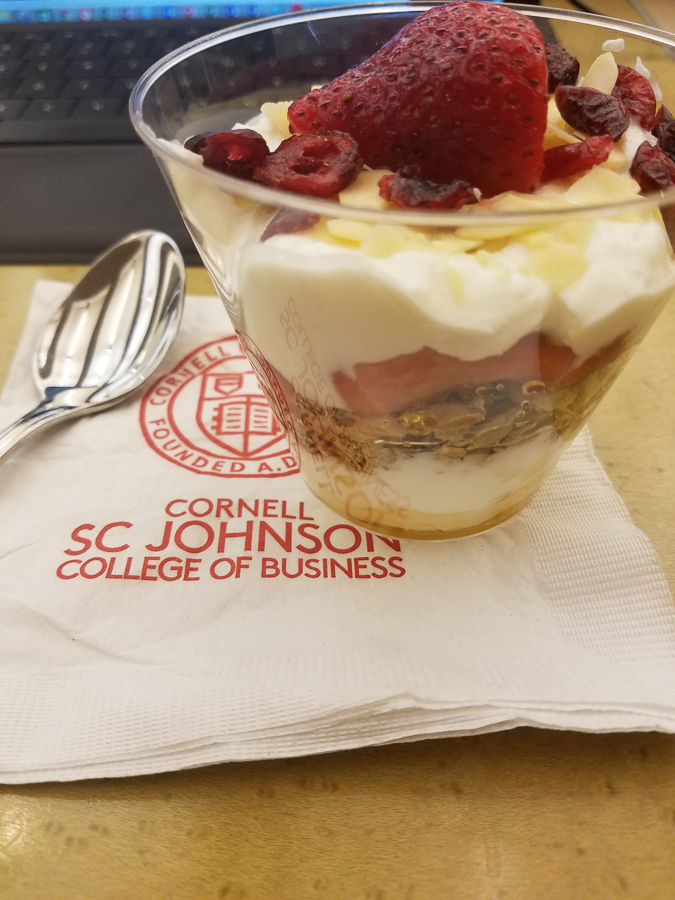 Yogurt cup on a Cornell SC Johnson College of Business napkin