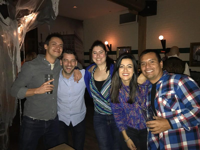 Students pose for a photo in a restaurant