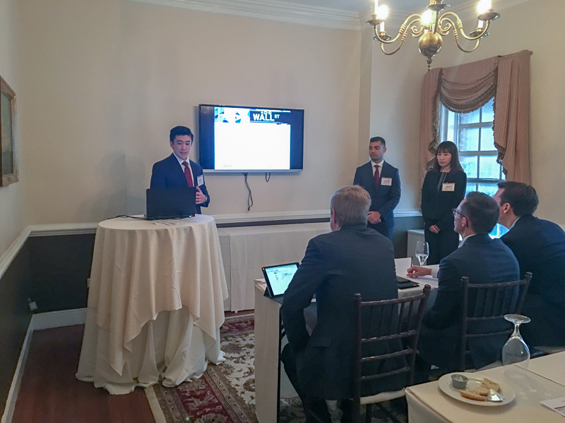 Group of students presenting at the front of a room