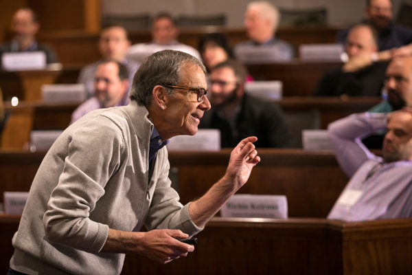 Edward McLaughlin lecturing in front of a group of students