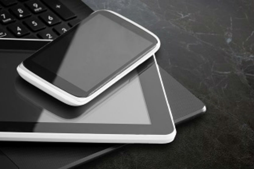 Laptop, tablet, phone stacked
