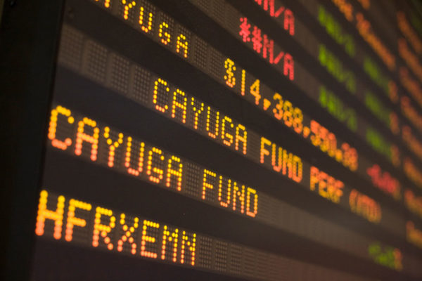 Photo of a stock ticker displaying Cayuga Fund and HFRXEMN