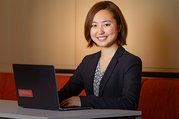 Sarah Song working at a laptop