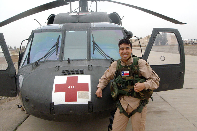 Anthony Garcia in front of Medevac hlicoptoer