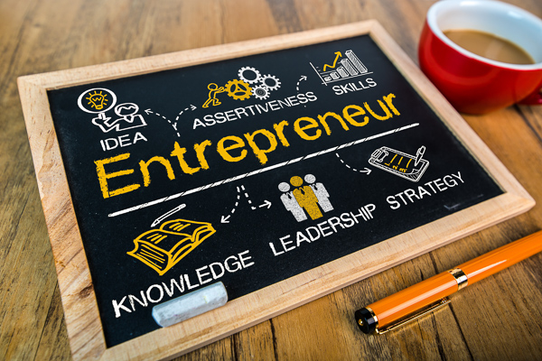 A chalkboard that says entrepreneur