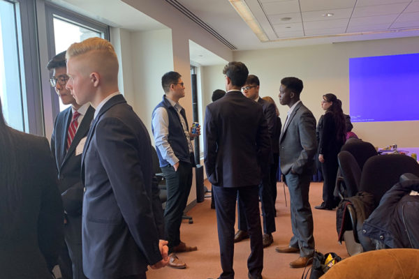 Students look out windows while networking