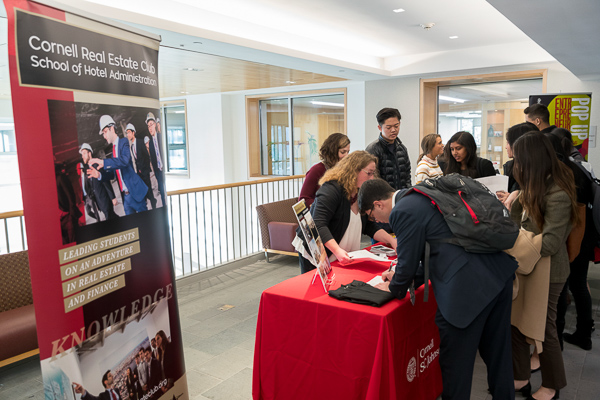 CREF booth with student visitors