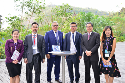 Six people standing outdoors