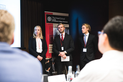 Three students presenting