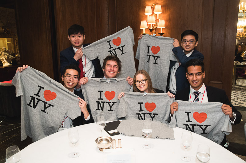 Members of the University of Cambridge team holding "I Love NY" shirts