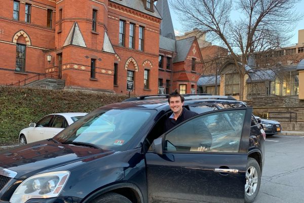 Colin Lang, Two-Year MBA '20, outside Sage Hall in his Acadia