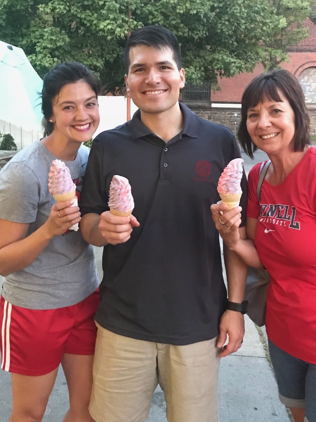 Three people holding ice cream cones