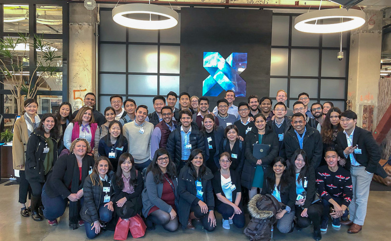 A large group of students in front of the Google X sign