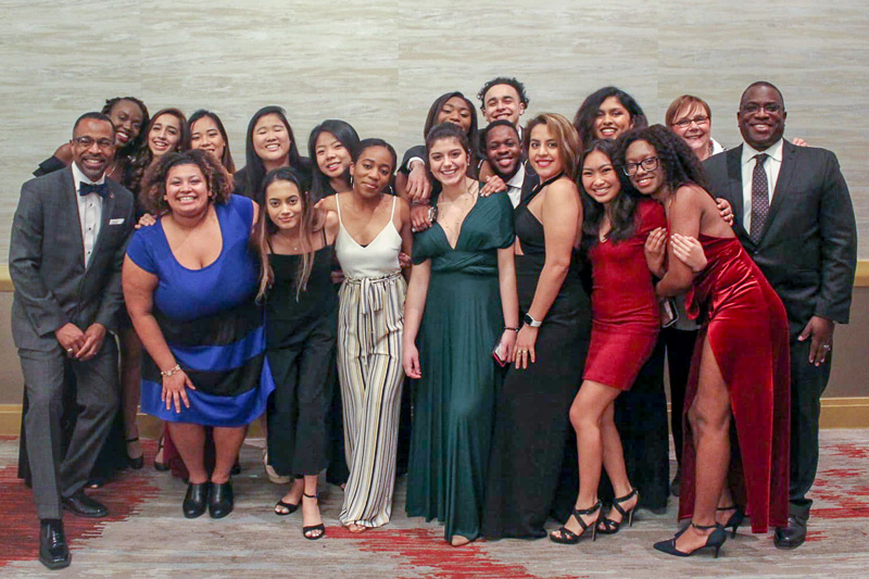 A group posing in formal attire