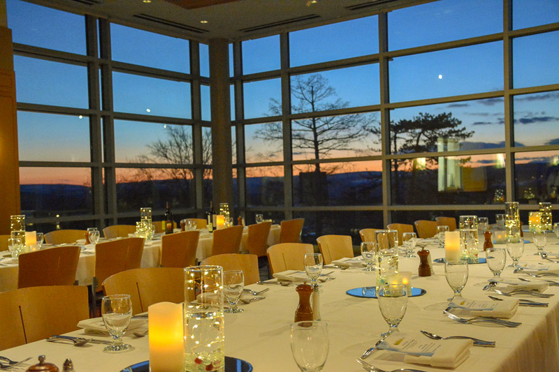 HEC Pop-Up table setting with a sunset in the background