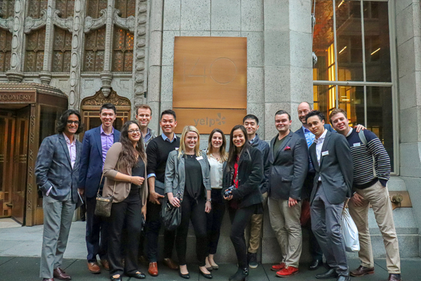 The group standing outside of Yelp's building