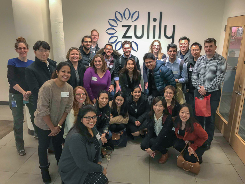 Students and visitors in front of a Zulily sign