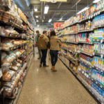 Students in a cooperative grocery store aisle
