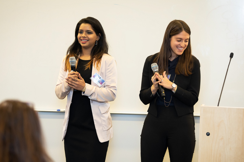 Chandi and Rebecca holding microphones