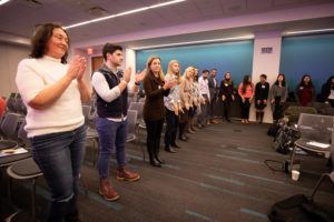 Audience standing in a circle