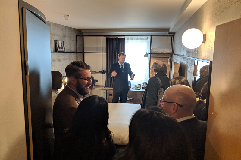 Faculty touring a hotel room