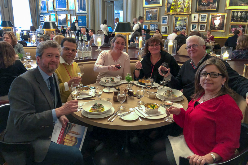 Faculty eating around a small round table