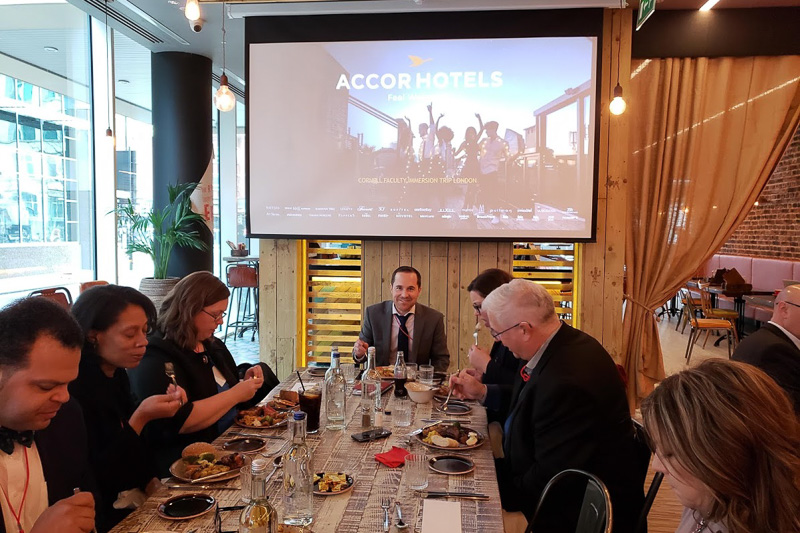 Faculty eating at a presentation