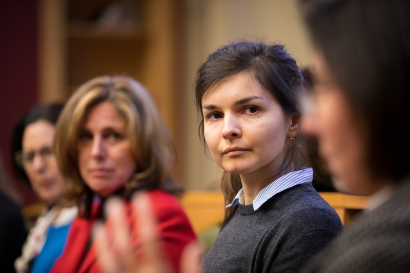 Ana Kalugina listening intently to her fellow panelist