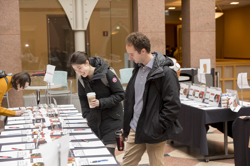 Students scanning the silent auction items up for bid 