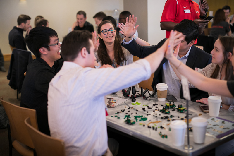Lego team builders giving high fives