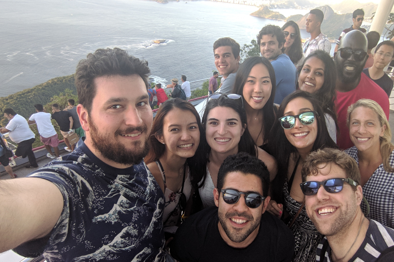 MBAs taking a selfie with Sugarloaf mountain in the background