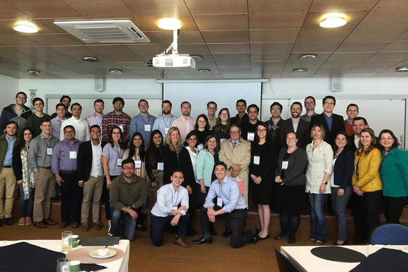 A large group of business students in a conference room