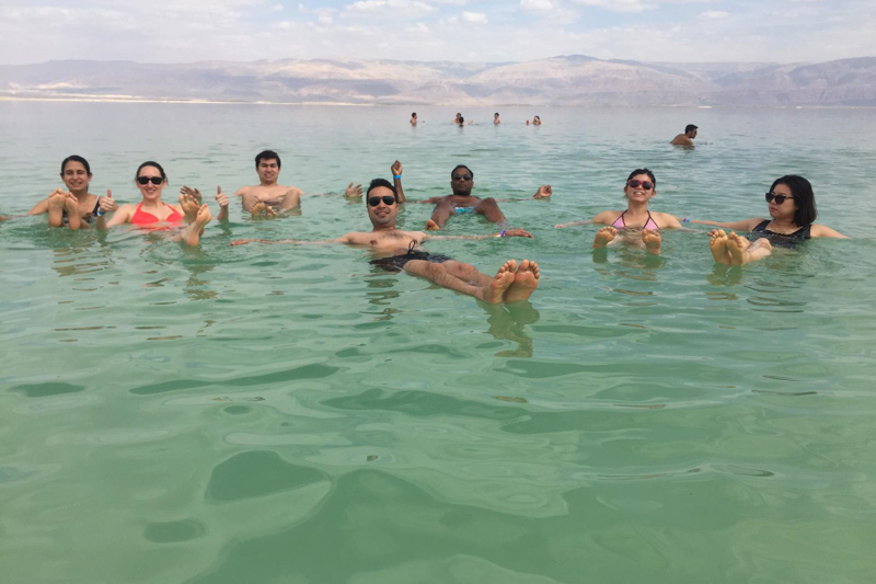 Students floating in the Dead Sea