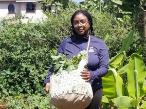 Ashley holding a bag of amaranth