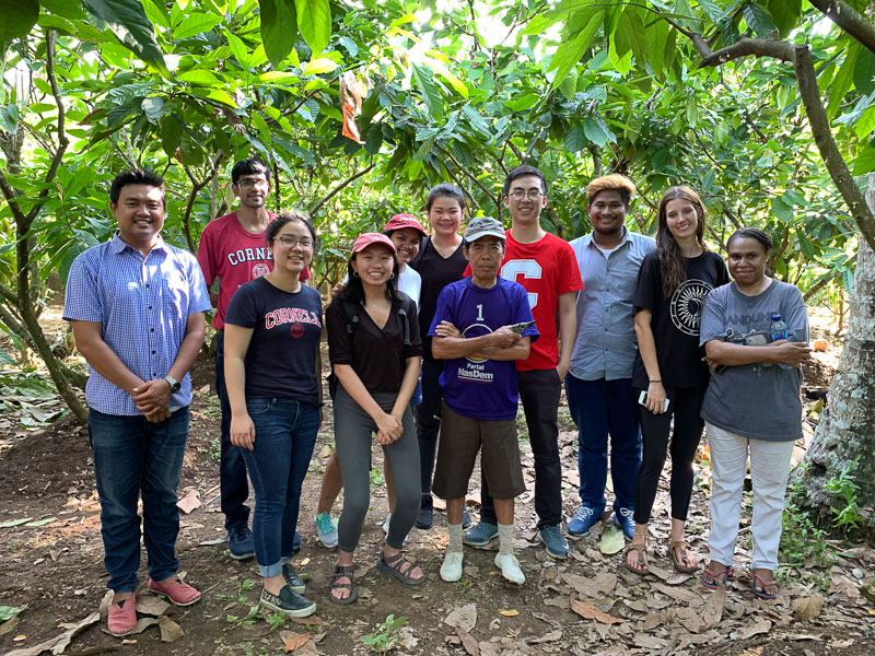 The group poses for a photo in outdoors