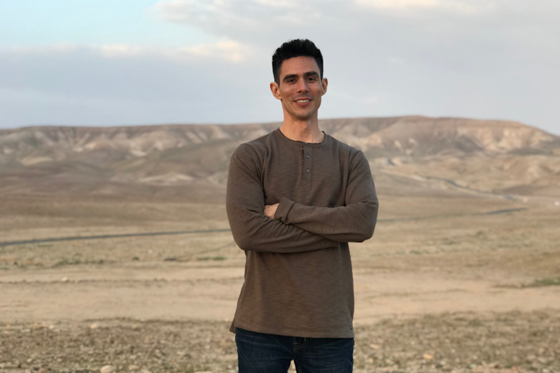 Mike Wagner with Bedouin Camp in the background