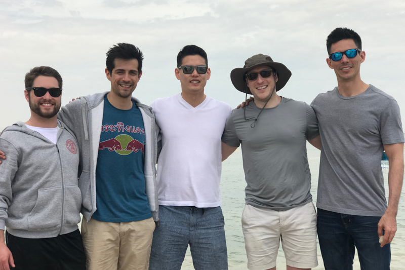 Five men with the Dead Sea in the background