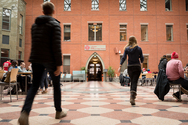 Students walking through Sage Hall