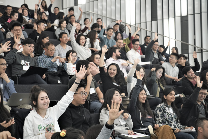 Audience raising their hands