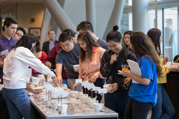 Students eating at the reception