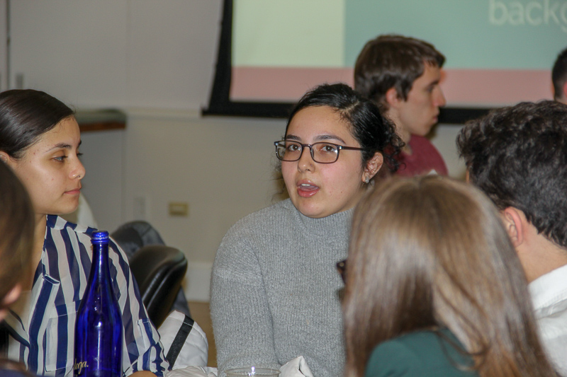 Trinity speaking at her table