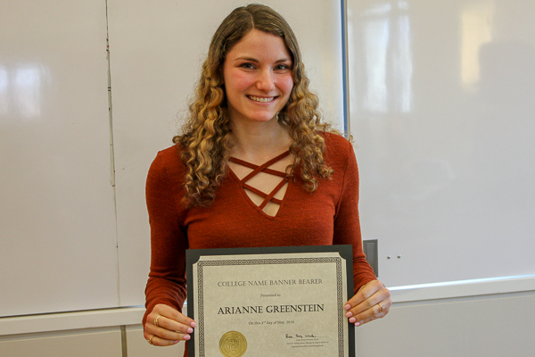 Adrianne Greenstein holding her award