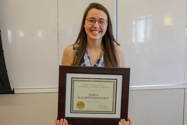 Maria Kalaitzandonakes holding her award