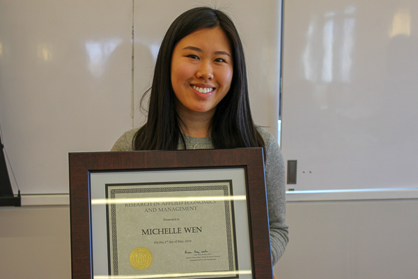 Michelle holding her award