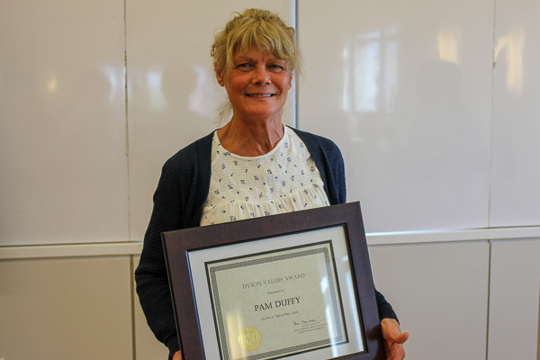 Pam Duffy holding her award