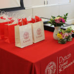 Table of gift bags and framed awards